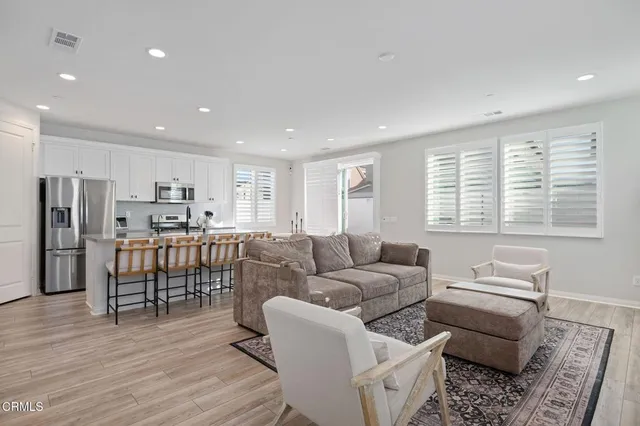 a living room with furniture and a table