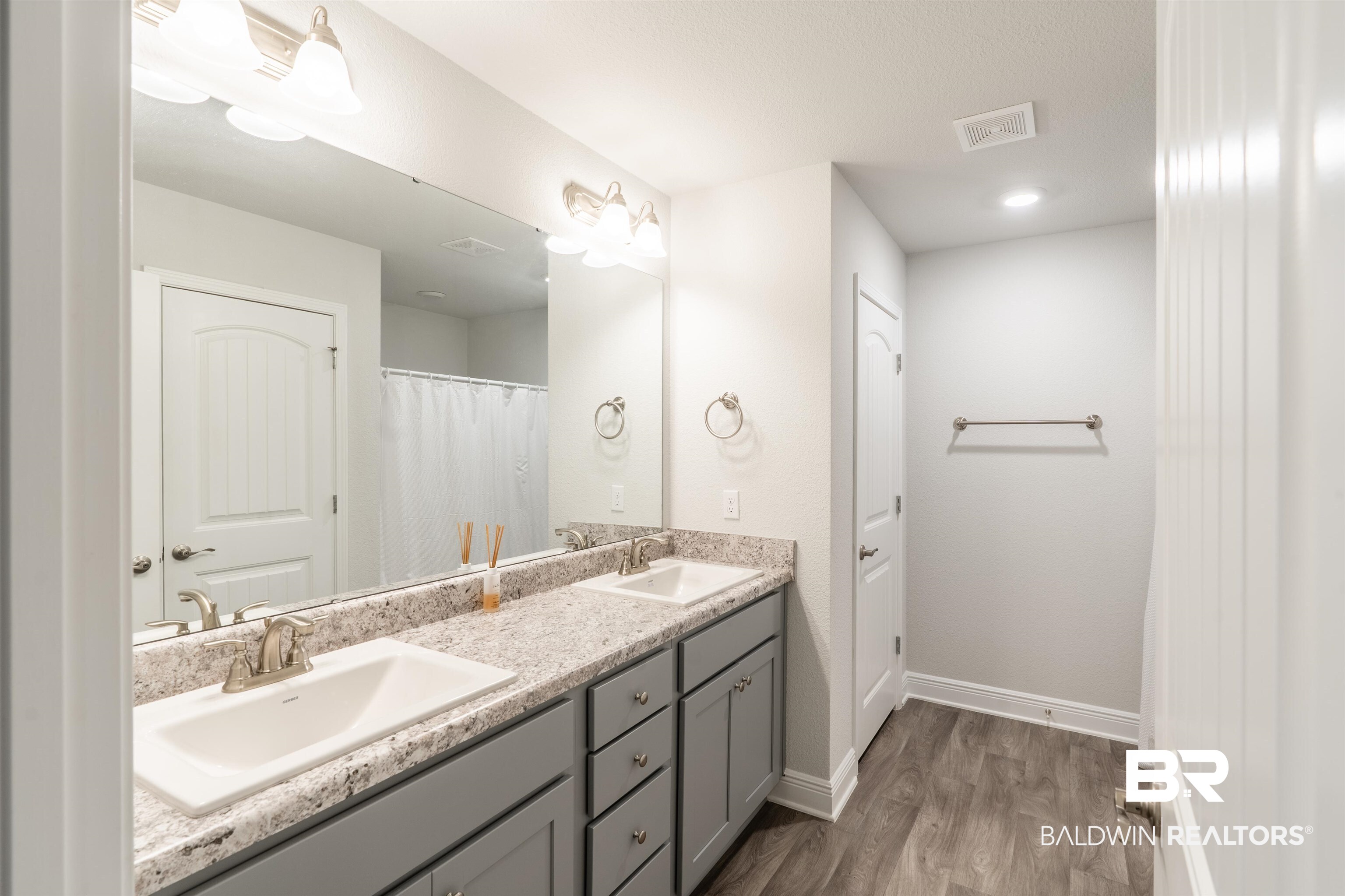 1906 Stonepine Drive South Semmes, AL 36575 - Photo 7 of 30 Bathroom with double vanity and dark wood-type flooring