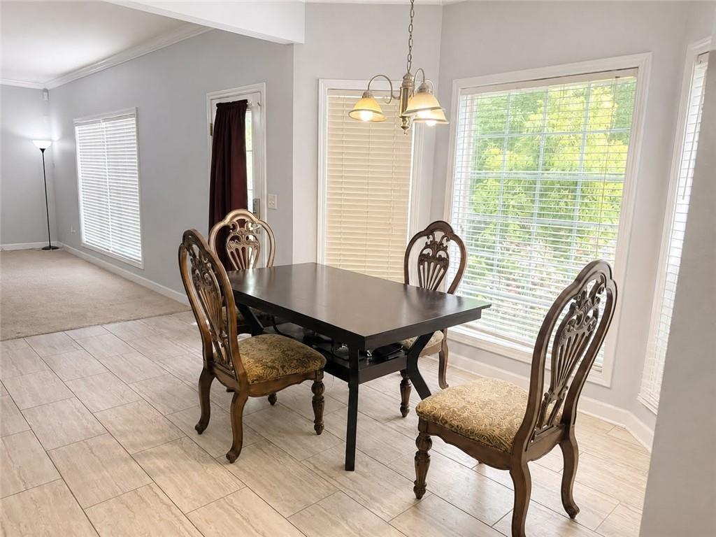3776 Mason Ridge Drive Winston, GA 30187 - Photo 12 of 48 a view of a dining room with furniture and window