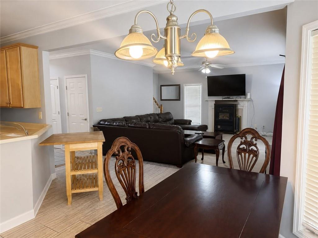 3776 Mason Ridge Drive Winston, GA 30187 - Photo 13 of 48 a living room with furniture a fireplace and a flat screen tv