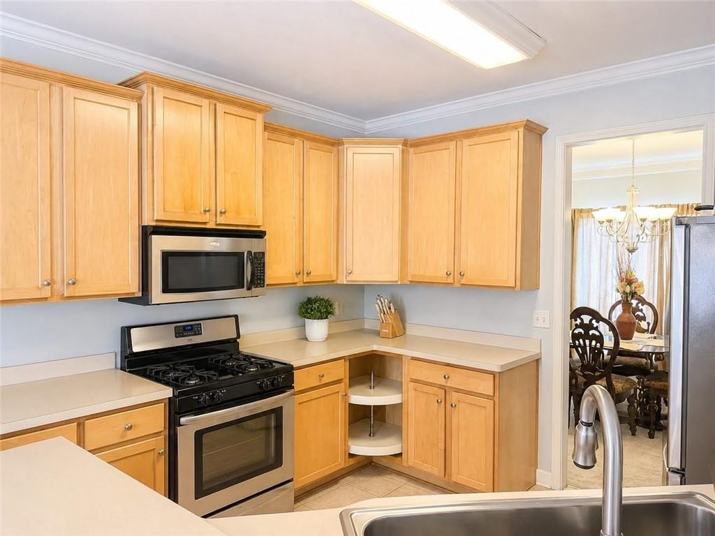 3776 Mason Ridge Drive Winston, GA 30187 - Photo 14 of 48 a kitchen with a stove a sink and a microwave
