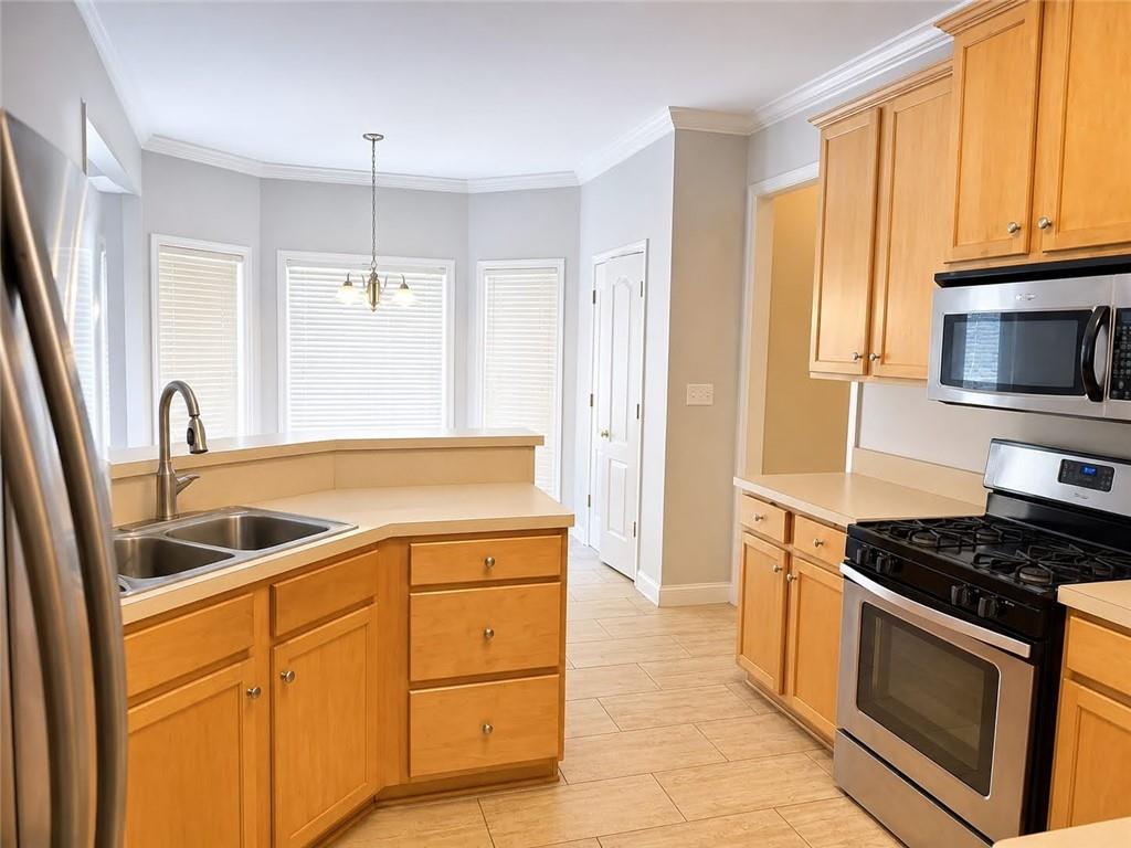 3776 Mason Ridge Drive Winston, GA 30187 - Photo 15 of 48 a kitchen with granite countertop a sink and steel appliances