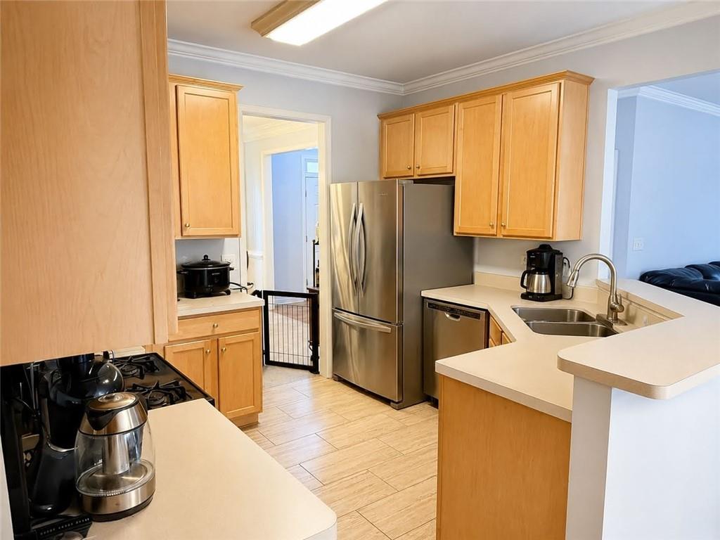 3776 Mason Ridge Drive Winston, GA 30187 - Photo 16 of 48 a kitchen with a refrigerator a stove a sink and a cabinets