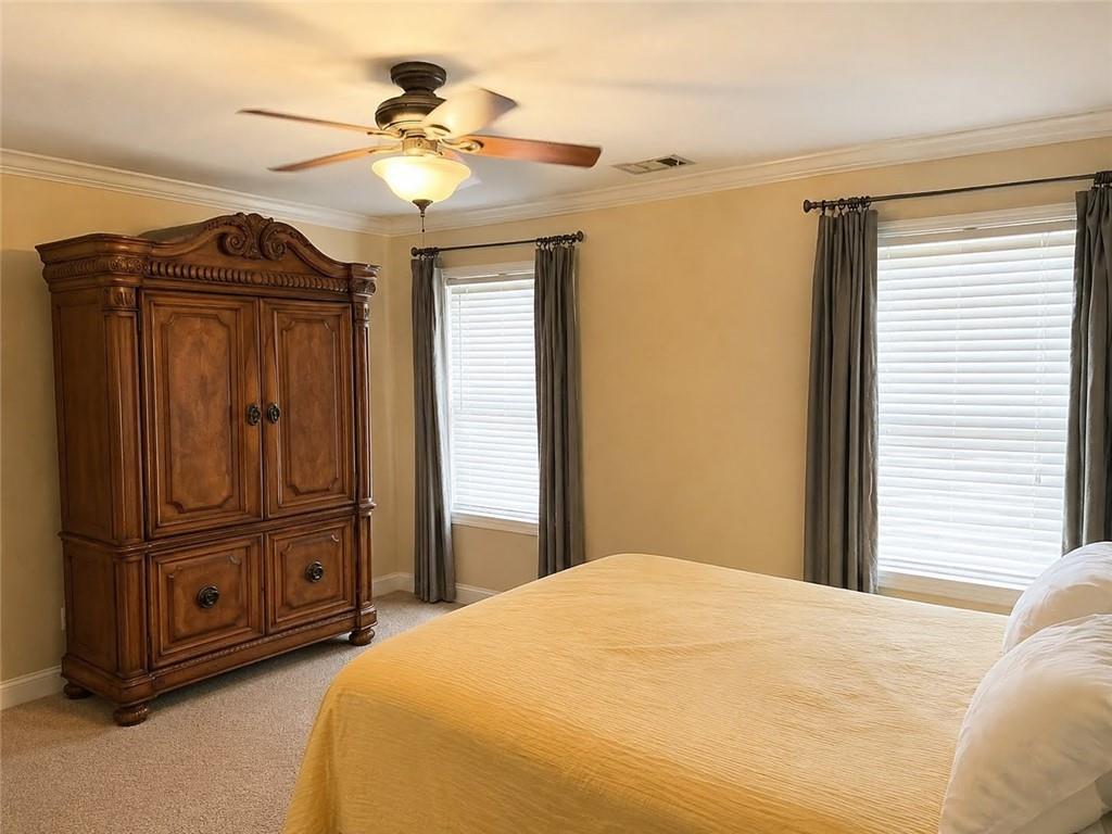3776 Mason Ridge Drive Winston, GA 30187 - Photo 21 of 48 a bedroom with a bed and a chandelier