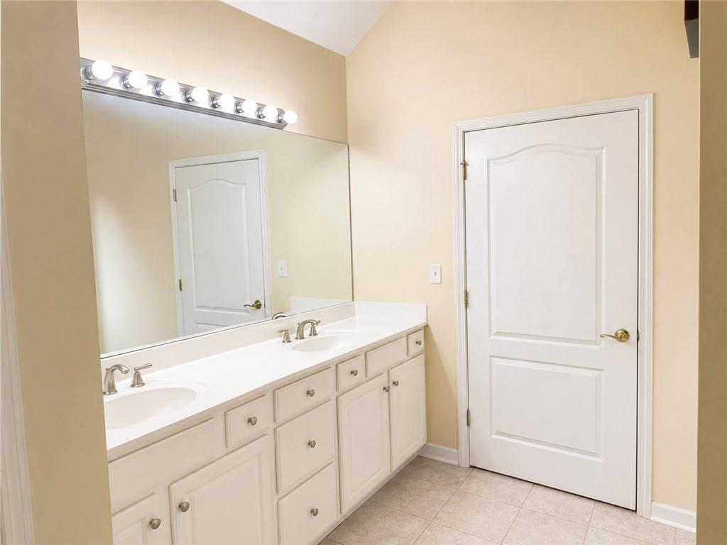 3776 Mason Ridge Drive Winston, GA 30187 - Photo 22 of 48 a bathroom with a double vanity sink and mirror