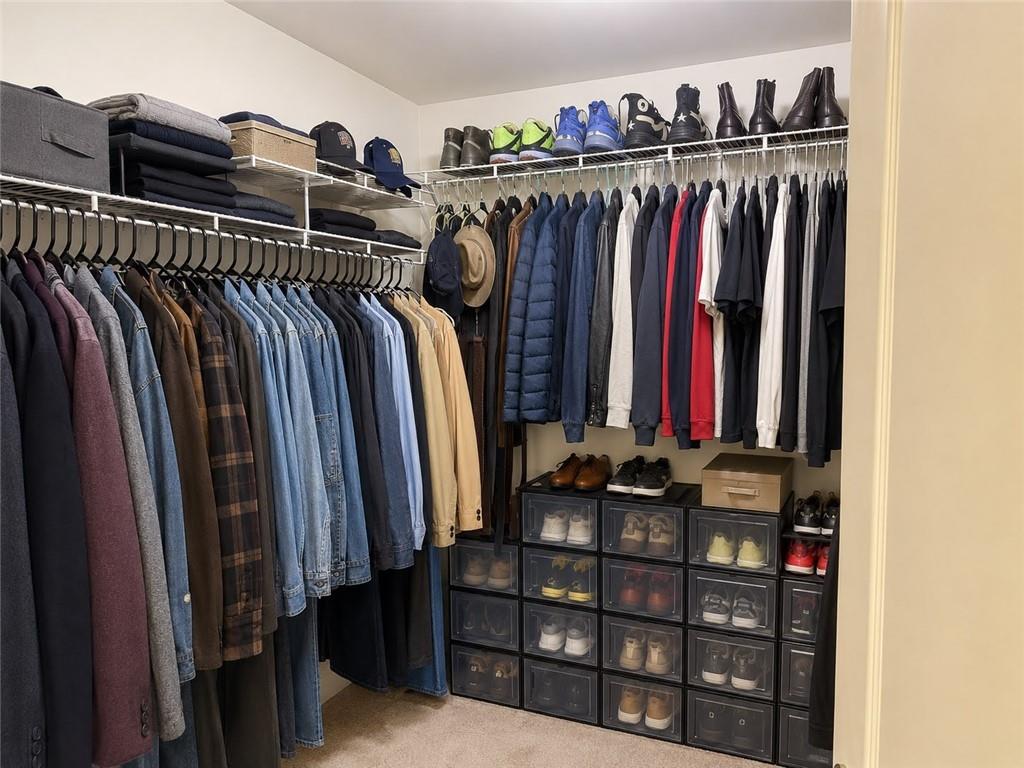 3776 Mason Ridge Drive Winston, GA 30187 - Photo 23 of 48 a view of walk in closet with clothes and shoes