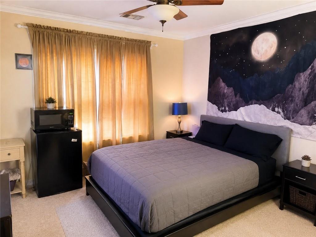 3776 Mason Ridge Drive Winston, GA 30187 - Photo 24 of 48 a bedroom with a bed and a lamp
