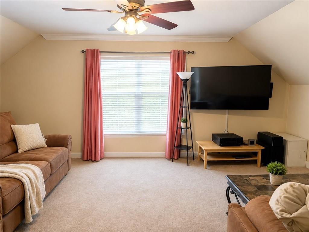 3776 Mason Ridge Drive Winston, GA 30187 - Photo 27 of 48 a living room with furniture and a flat screen tv