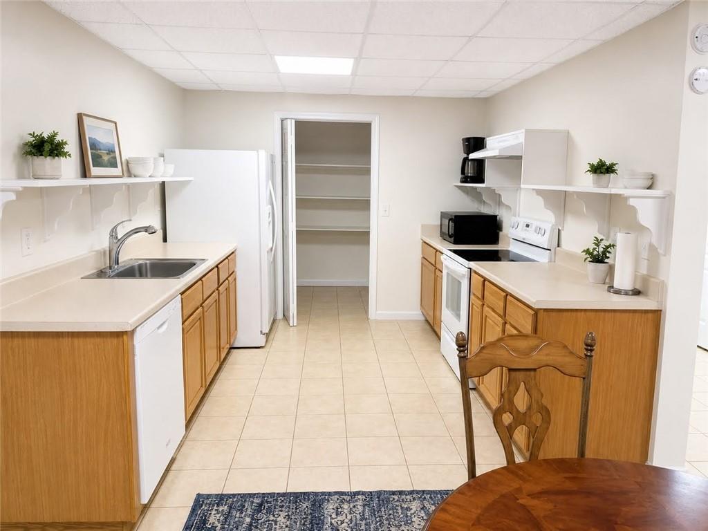 3776 Mason Ridge Drive Winston, GA 30187 - Photo 34 of 48 a kitchen with a sink appliances and cabinets
