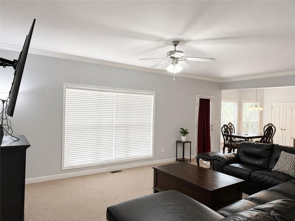 3776 Mason Ridge Drive Winston, GA 30187 - Photo 35 of 48 a living room with furniture a chandelier and a window
