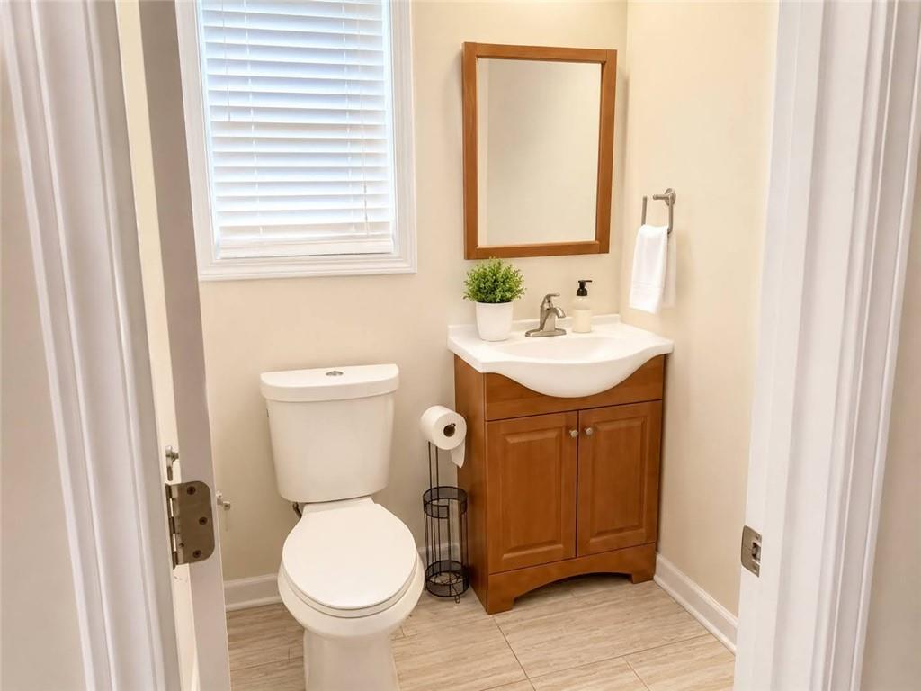 3776 Mason Ridge Drive Winston, GA 30187 - Photo 37 of 48 a bathroom with a toilet sink and mirror