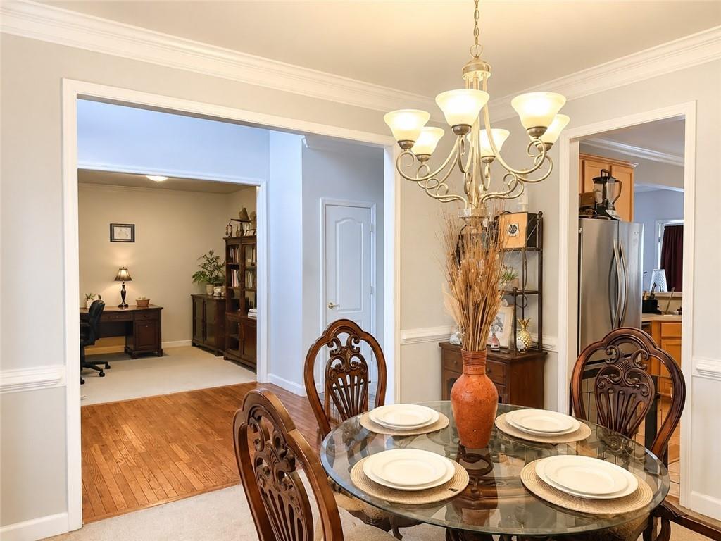 3776 Mason Ridge Drive Winston, GA 30187 - Photo 8 of 48 a dining room with furniture and a chandelier