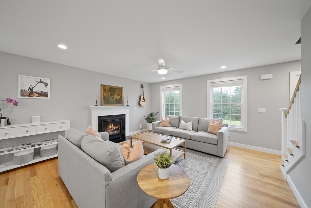 7 Kennard Road Epping, NH 03042 - Photo 11 of 42 a living room with furniture and a fireplace