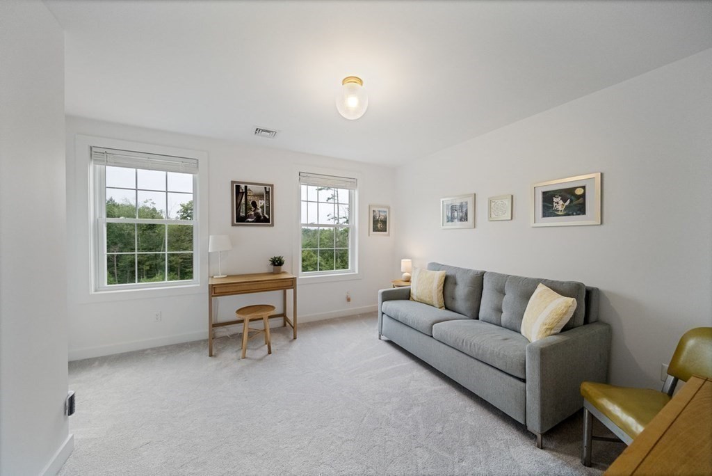 7 Kennard Road Epping, NH 03042 - Photo 17 of 42 a living room with furniture and a window