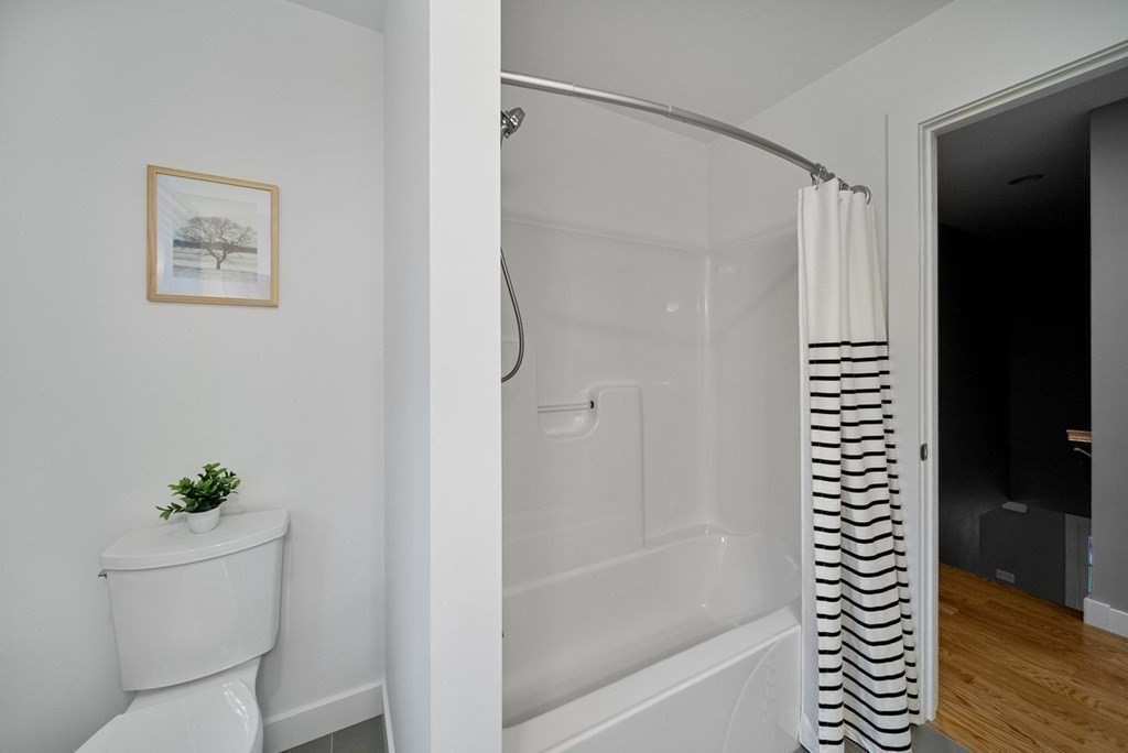 7 Kennard Road Epping, NH 03042 - Photo 23 of 42 a bathroom with a shower and a toilet