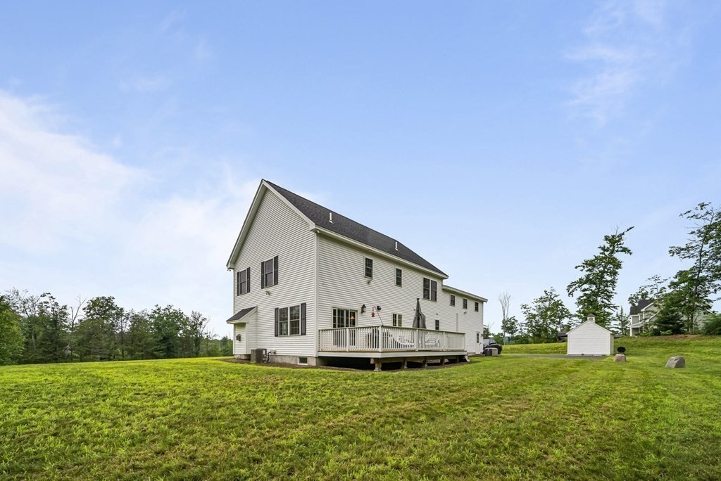 7 Kennard Road Epping, NH 03042 - Photo 34 of 42 a view of a house with a big yard and large trees