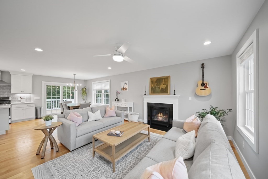 7 Kennard Road Epping, NH 03042 - Photo 9 of 42 a living room with furniture fireplace and a window