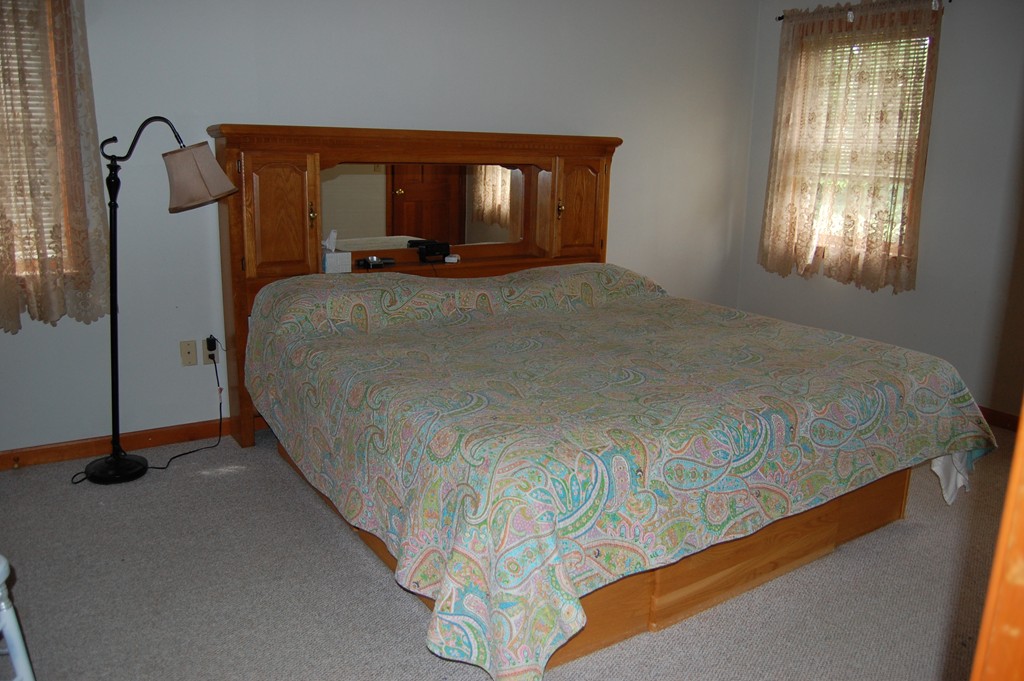 81 Old Ferry Road Haverhill, MA 01830 - Photo 14 of 17 a bedroom with a bed and a mirror