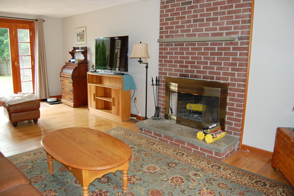 81 Old Ferry Road Haverhill, MA 01830 - Photo 10 of 17 a living room with furniture and a fireplace
