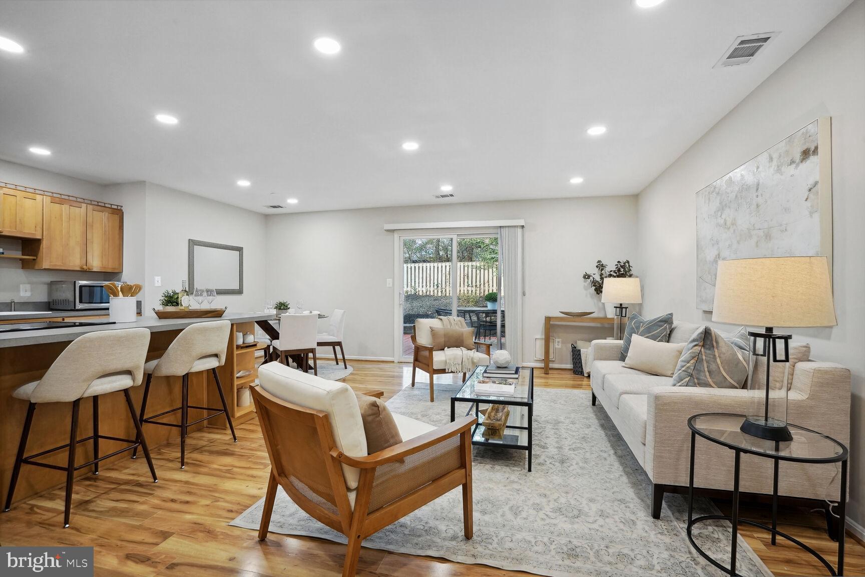 11408 Turnmill Lane Reston, VA 20191 - Photo 2 of 17 a living room with furniture and a flat screen tv