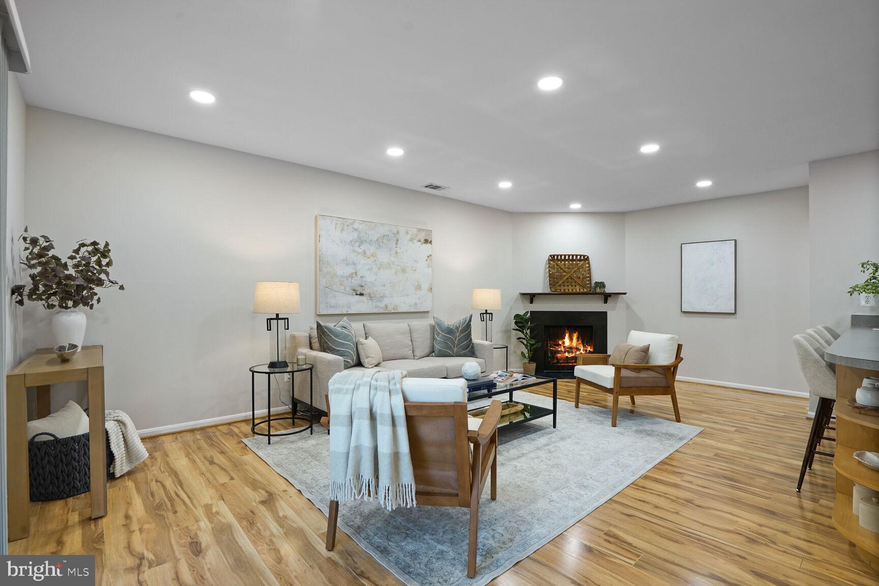 11408 Turnmill Lane Reston, VA 20191 - Photo 3 of 17 a living room with furniture and wooden floor