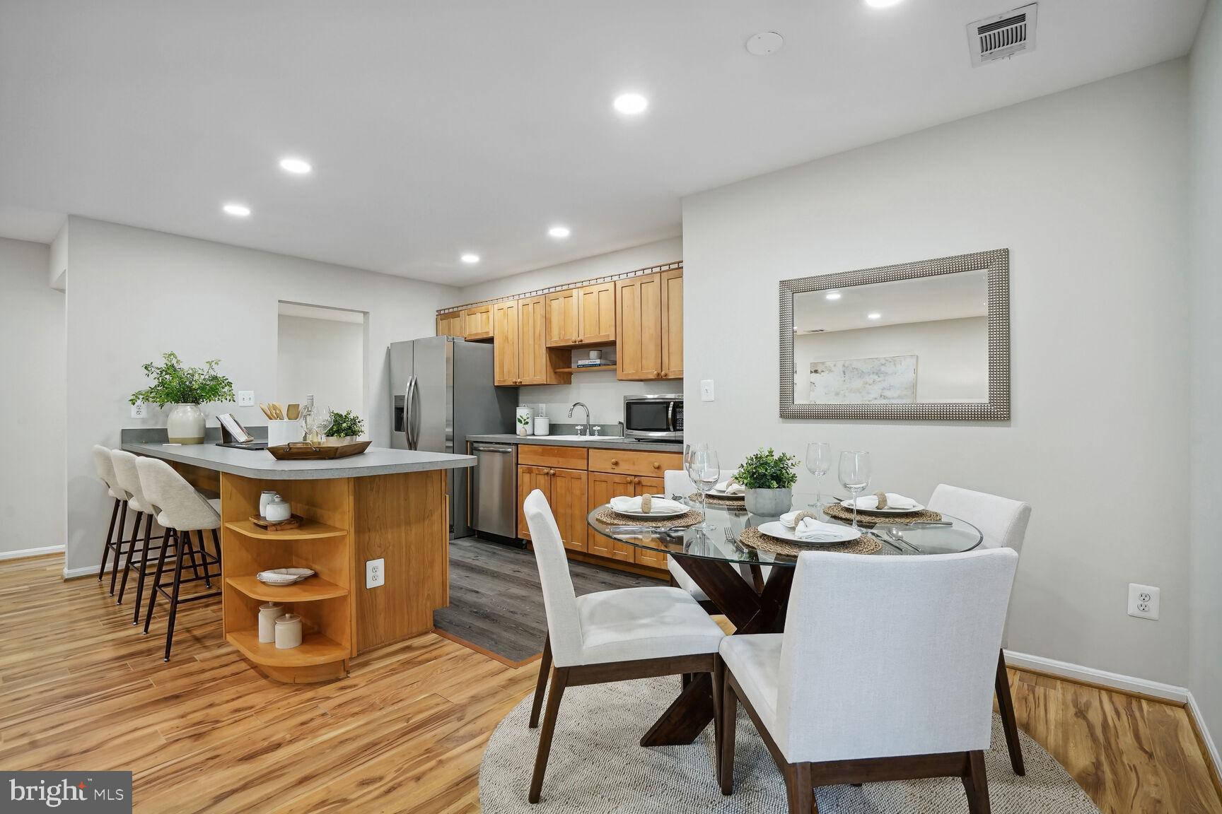 11408 Turnmill Lane Reston, VA 20191 - Photo 6 of 17 a dining room with furniture and wooden floor