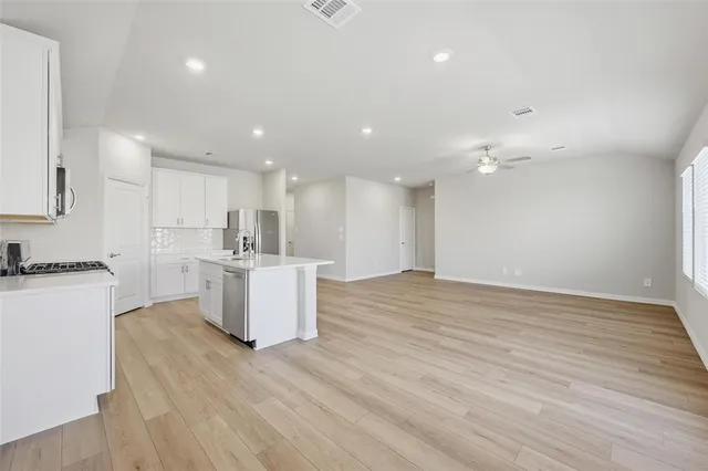 a view of kitchen with wooden floor