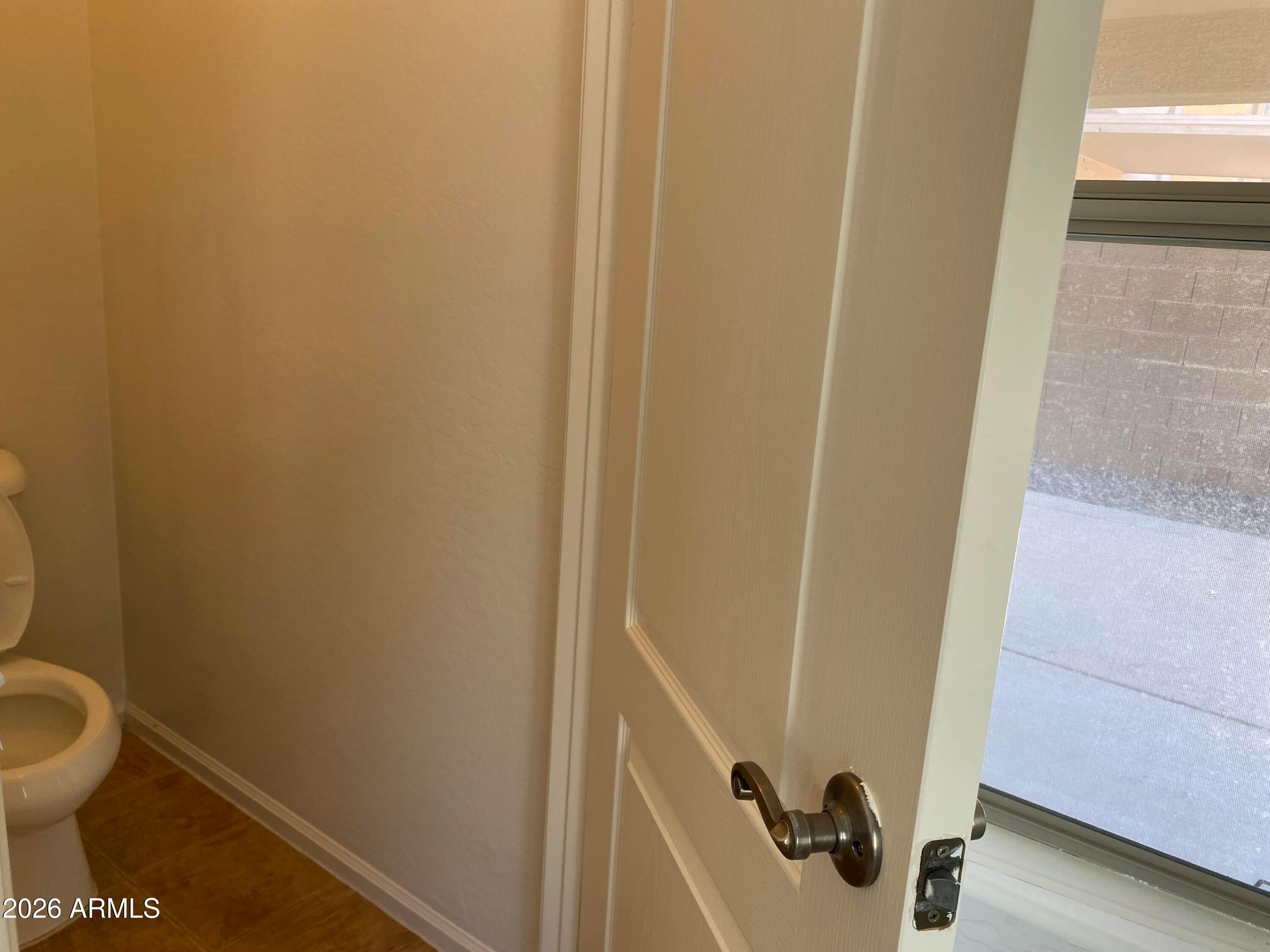 9124 West Heber Road Tolleson, AZ 85353 - Photo 18 of 26 a bathroom with a sink and toilet