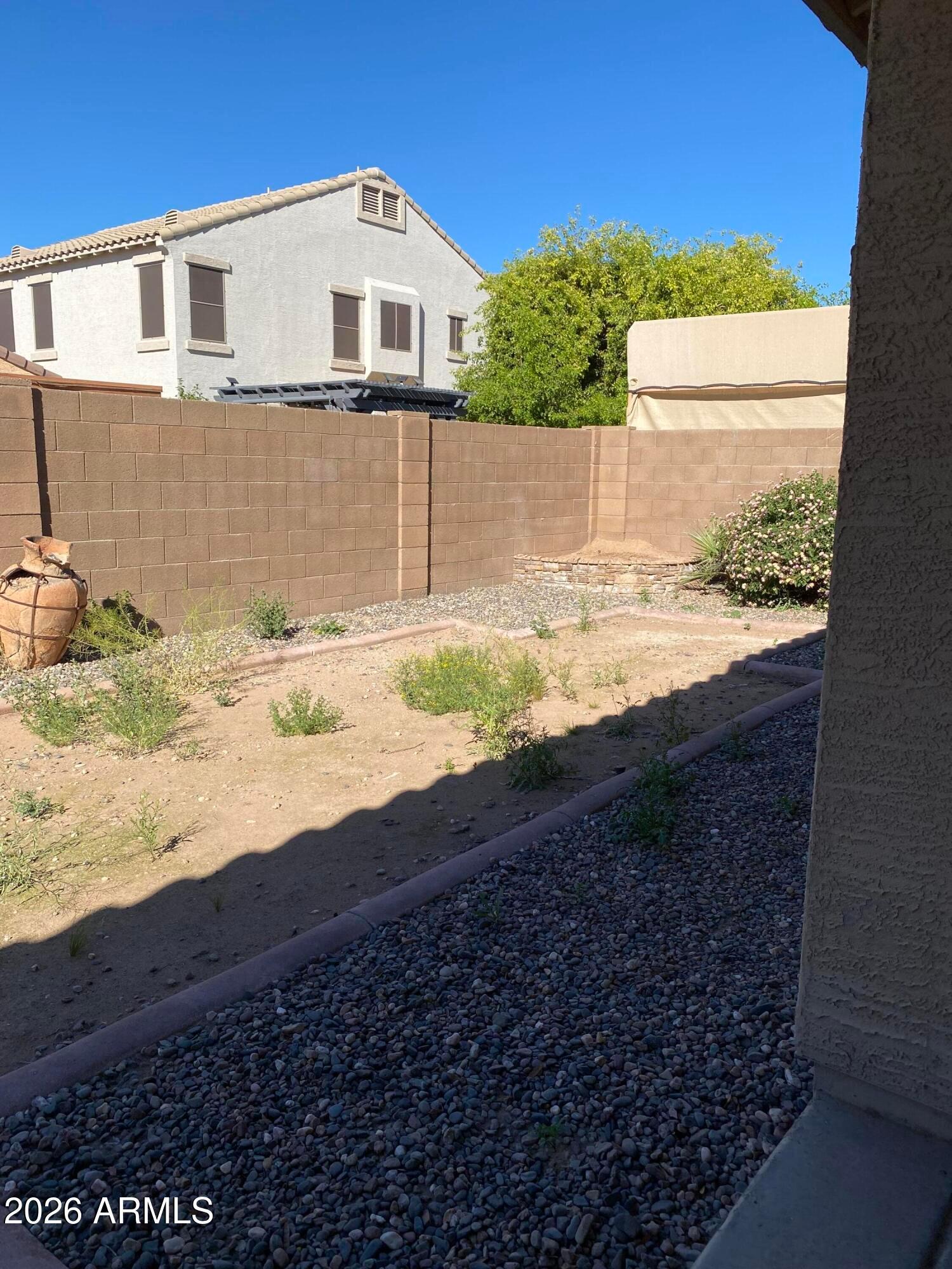 9124 West Heber Road Tolleson, AZ 85353 - Photo 26 of 26 a view of a back yard of the house