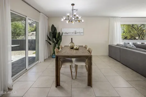 a dining room with furniture and window