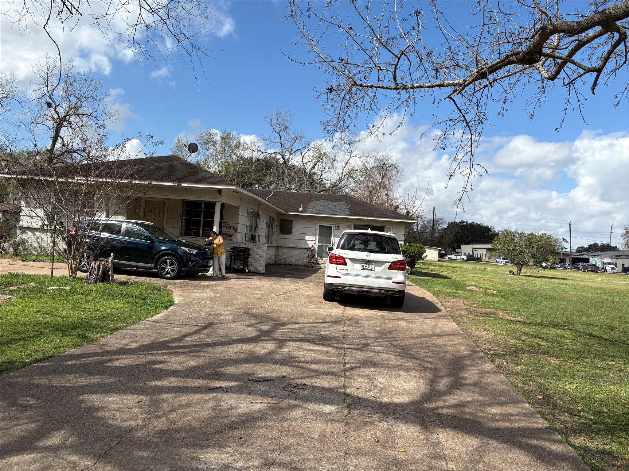 2508 4th Street Rosenberg, TX 77471 - Photo 3 of 13 a car parked in the yard of a house