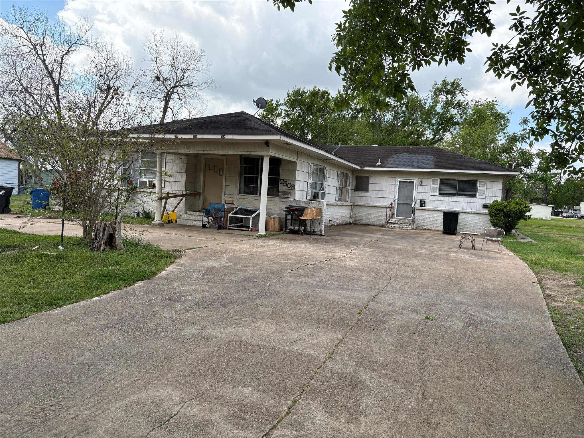 2508 4th Street Rosenberg, TX 77471 - Photo 8 of 13 a front view of a house with a yard and trees
