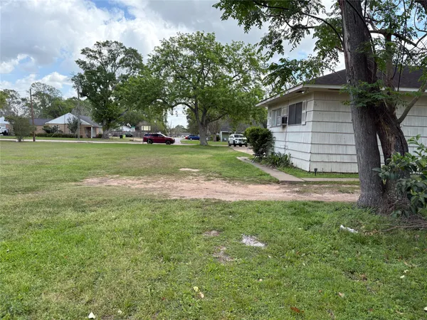 a view of backyard with green space