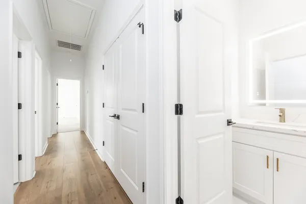 a bathroom with a sink a mirror and a shower
