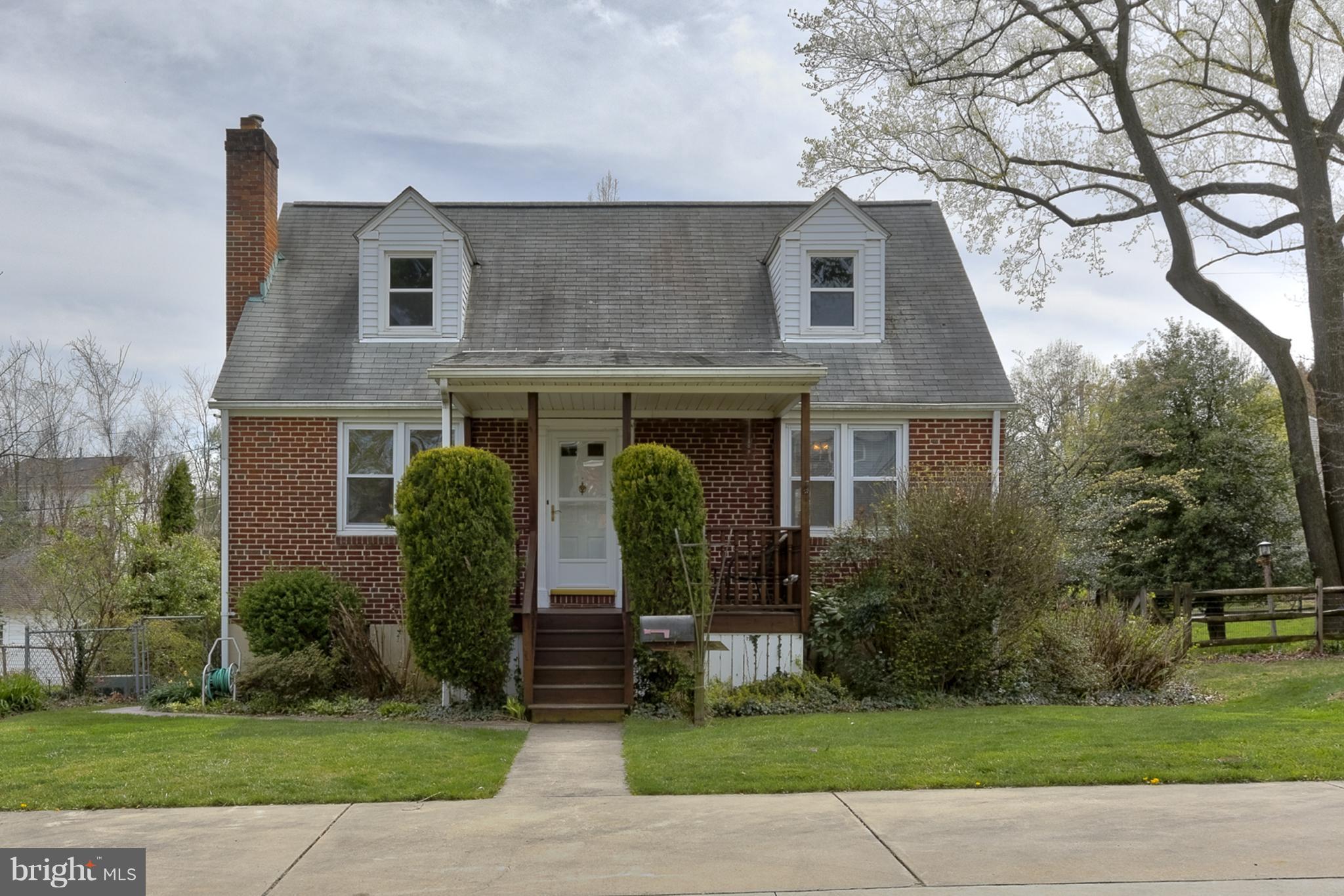 618 Coleraine Road Baltimore, MD 21229 - Photo 1 of 27 a front view of a house with garden