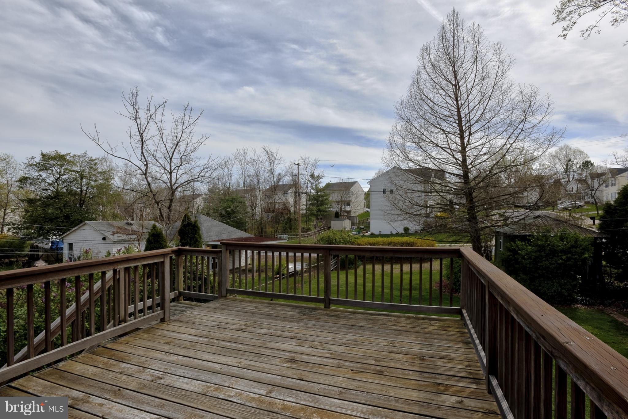 618 Coleraine Road Baltimore, MD 21229 - Photo 22 of 27 a view of balcony with wooden floor and fence