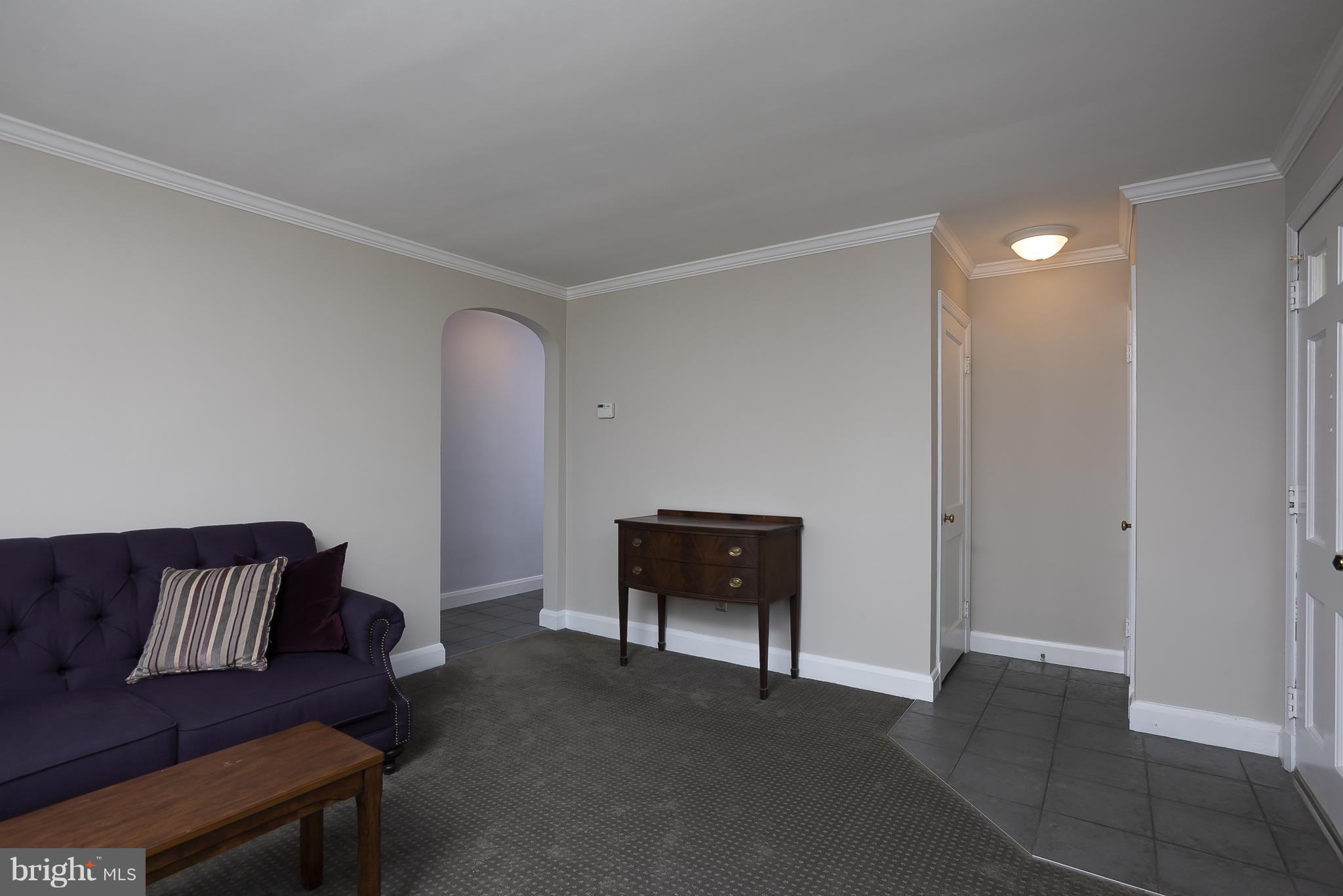 618 Coleraine Road Baltimore, MD 21229 - Photo 7 of 27 a living room with furniture and a rug