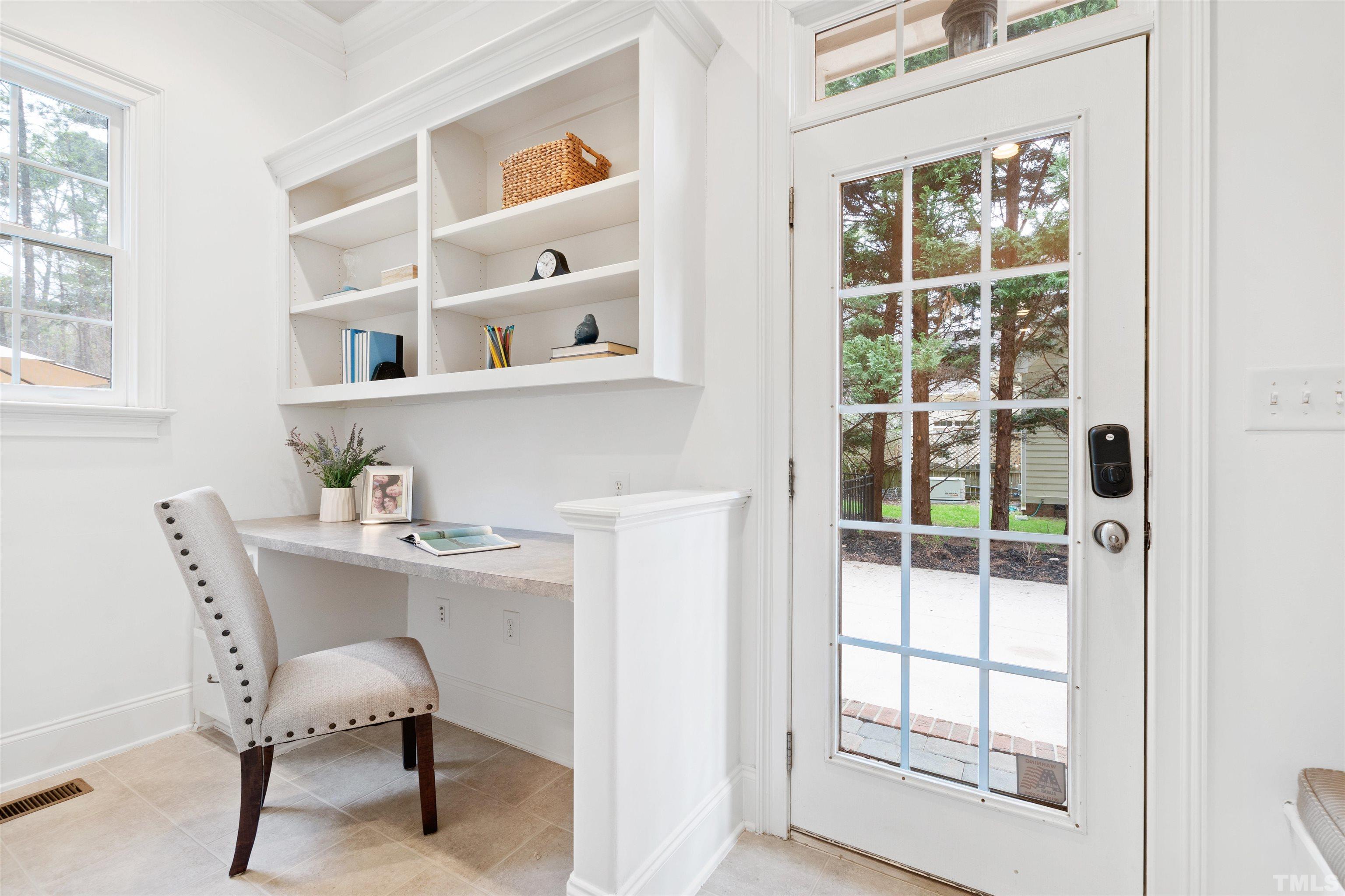 1904 Bowling Green Trail Raleigh, NC 27613 - Photo 24 of 43 a view of a workspace with furniture and a window