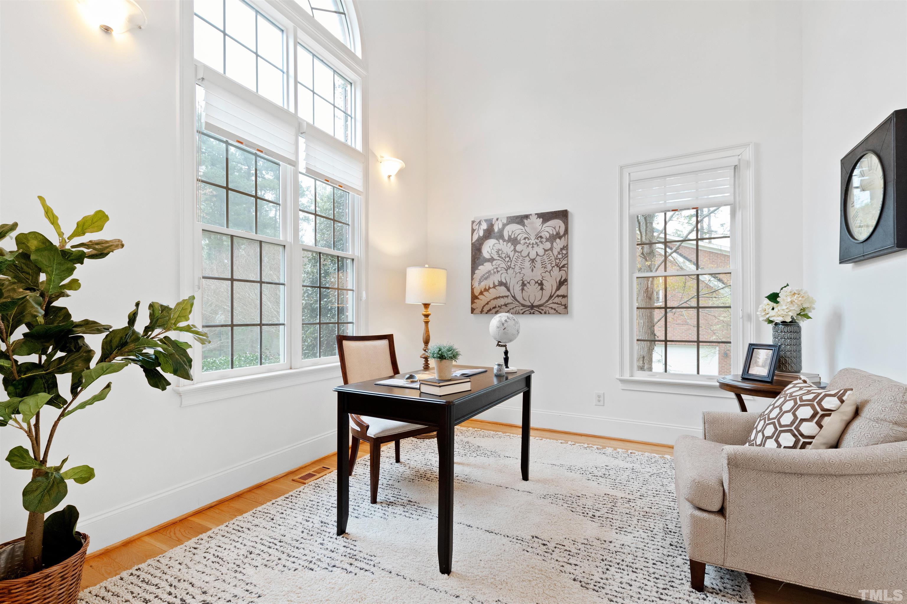 1904 Bowling Green Trail Raleigh, NC 27613 - Photo 3 of 43 a living room with furniture a window and a table