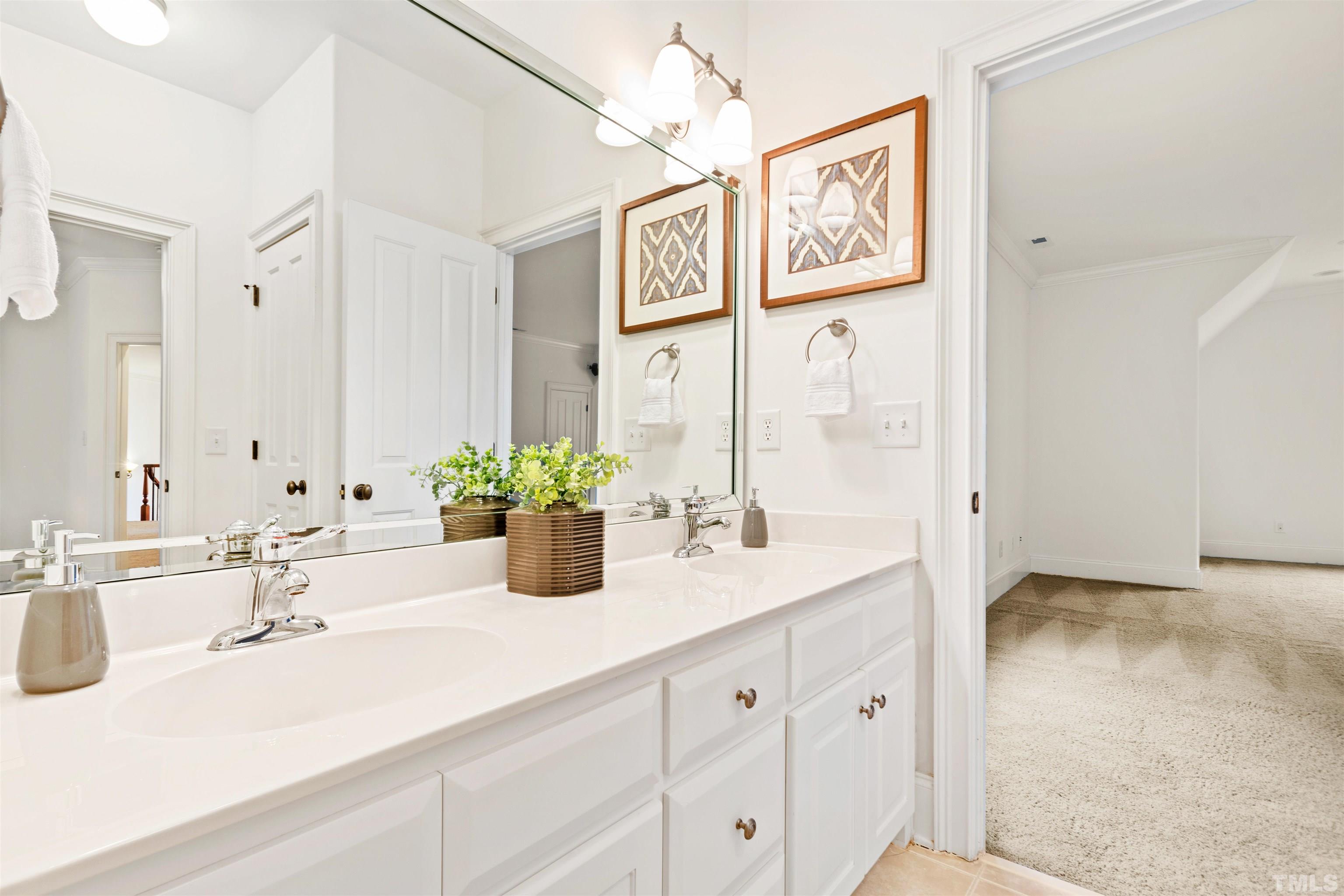 1904 Bowling Green Trail Raleigh, NC 27613 - Photo 34 of 43 a bathroom with a sink and a mirror