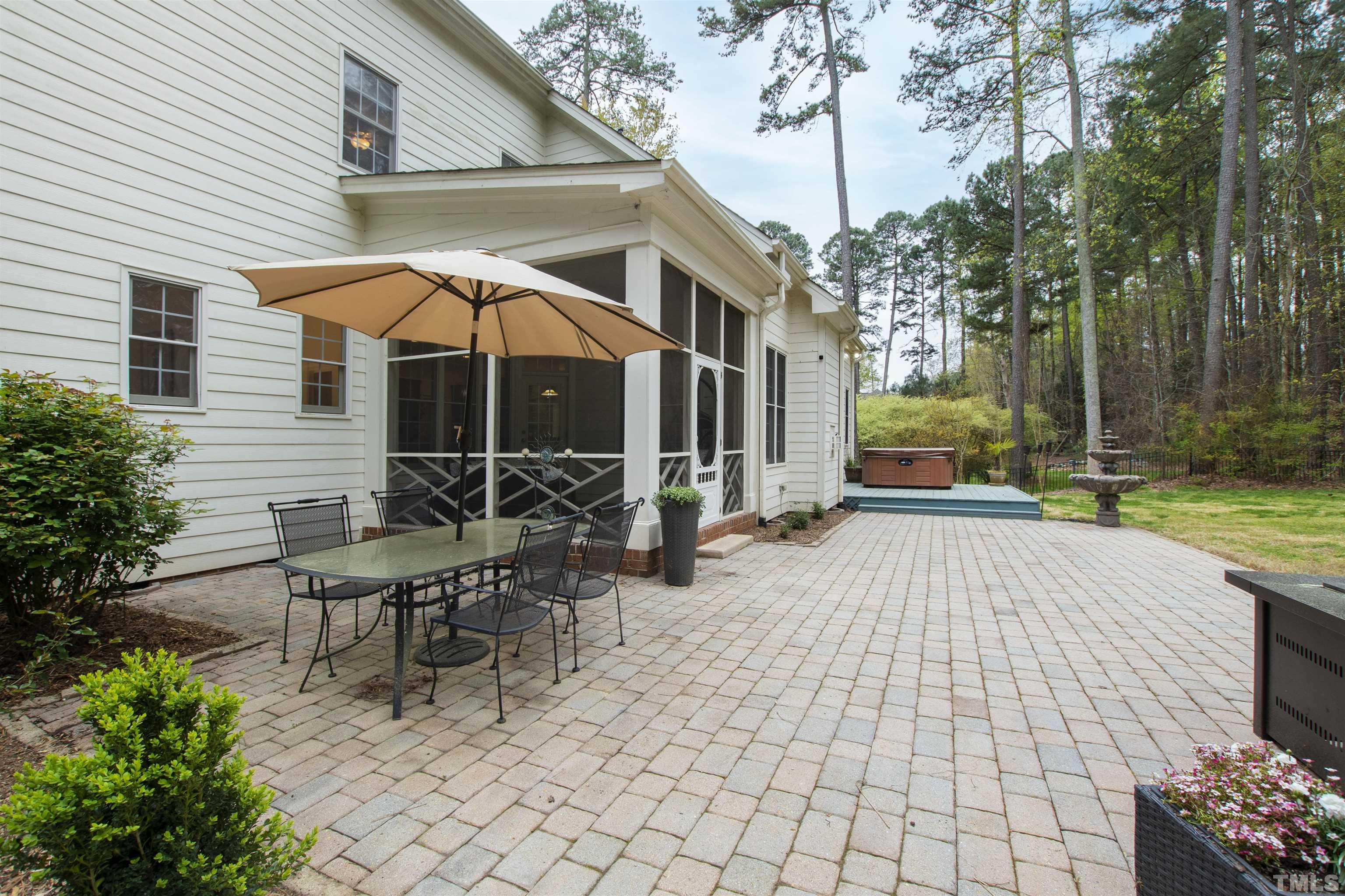 1904 Bowling Green Trail Raleigh, NC 27613 - Photo 43 of 43 a view of a patio with table and chairs under an umbrella