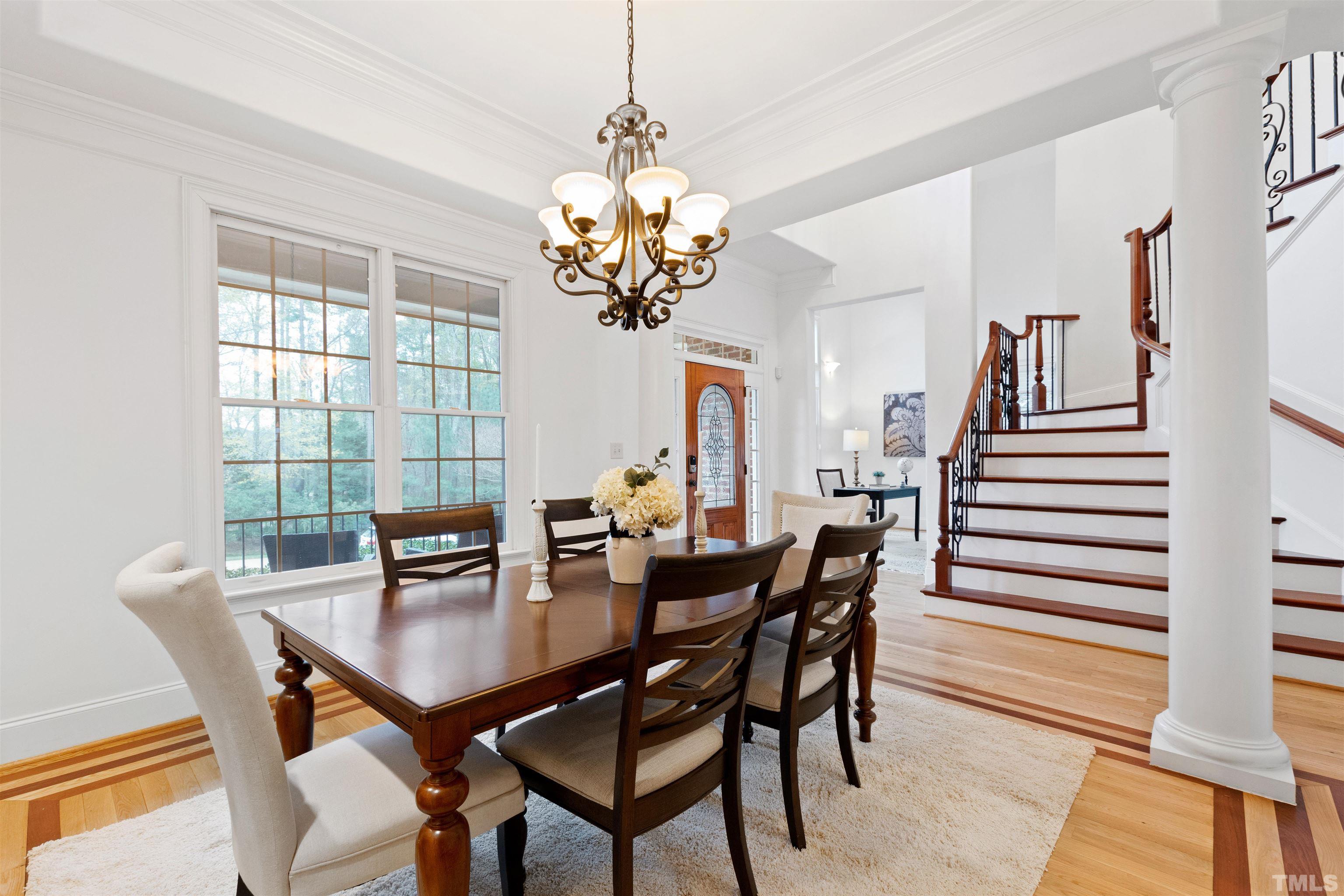 1904 Bowling Green Trail Raleigh, NC 27613 - Photo 6 of 43 a view of a dining room with furniture and wooden floor