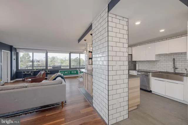 a lobby with a couch and a large window