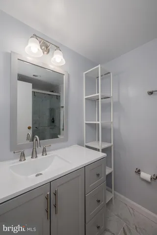 a bathroom with a sink a vanity and a mirror