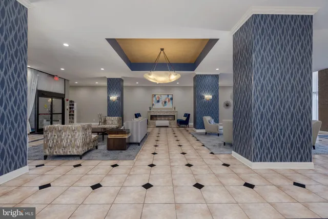 a large white kitchen with a large window