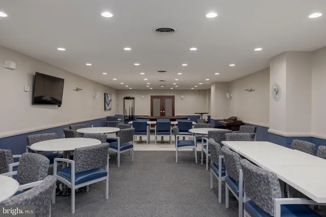 a living room with lots of furniture and a flat screen tv