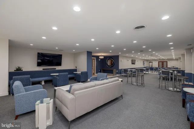 a living room with furniture and a view of a living room