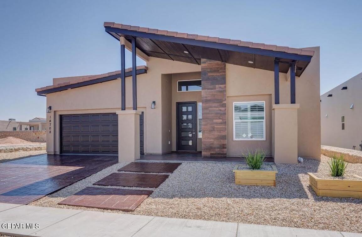 a front view of house with outdoor seating