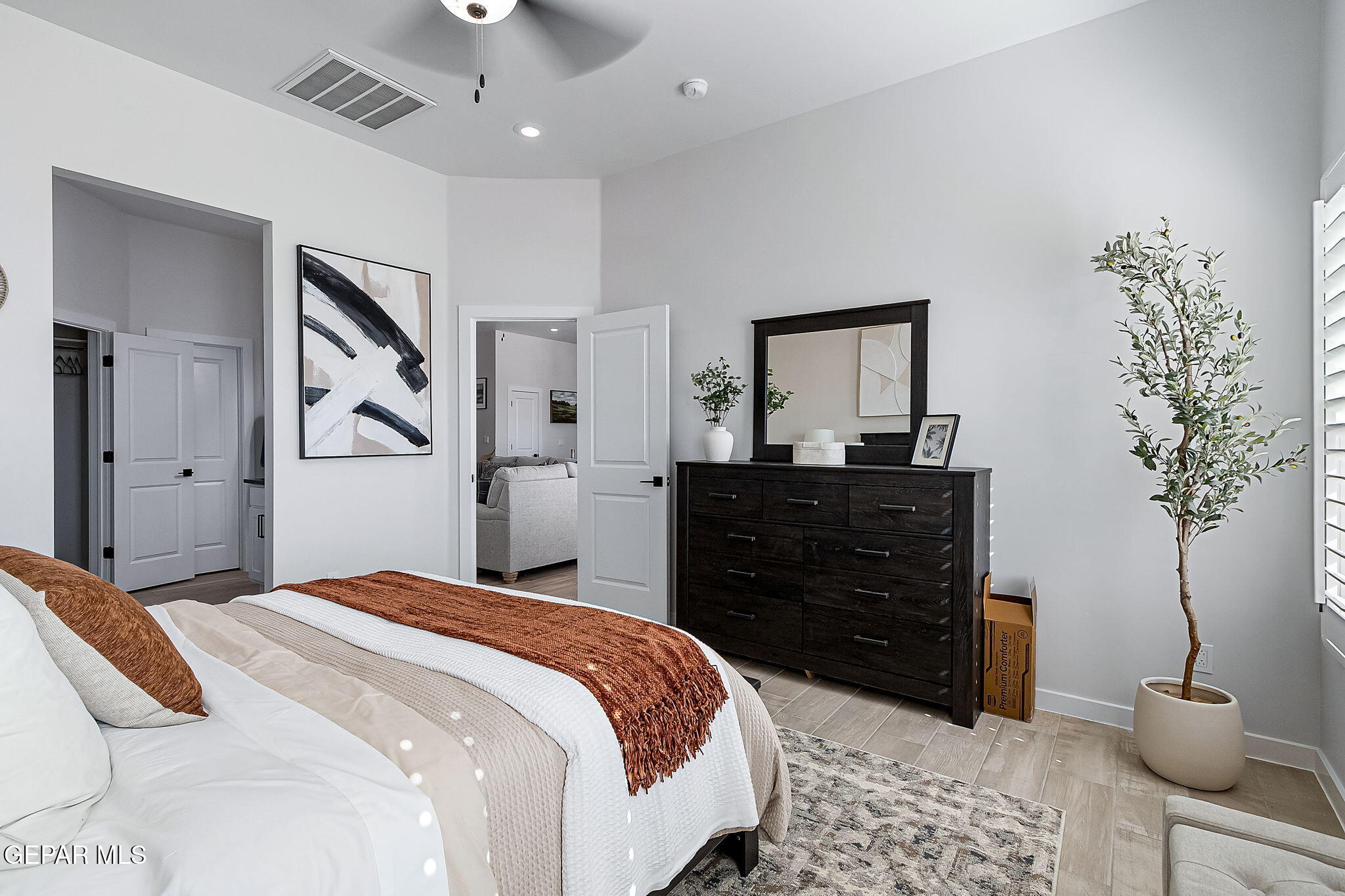 3837 Object Place El Paso, TX 79938 - Photo 3 of 18 a bedroom with a bed and a potted plant