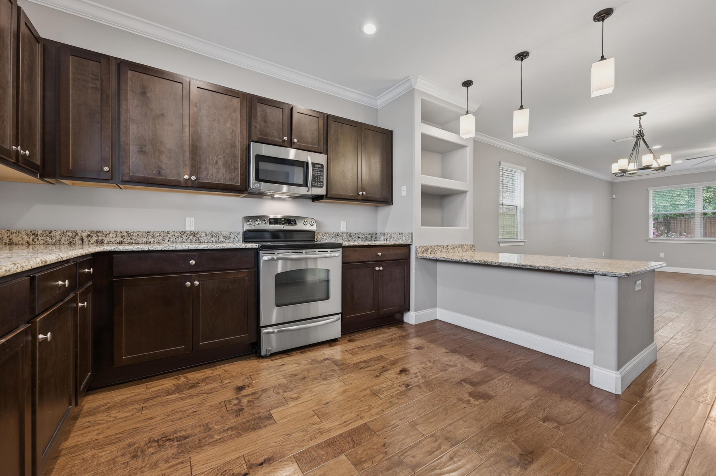 106 Arrowhead Way Niceville, FL 32578 - Photo 13 of 39 a kitchen with stainless steel appliances granite countertop a stove a sink and a refrigerator